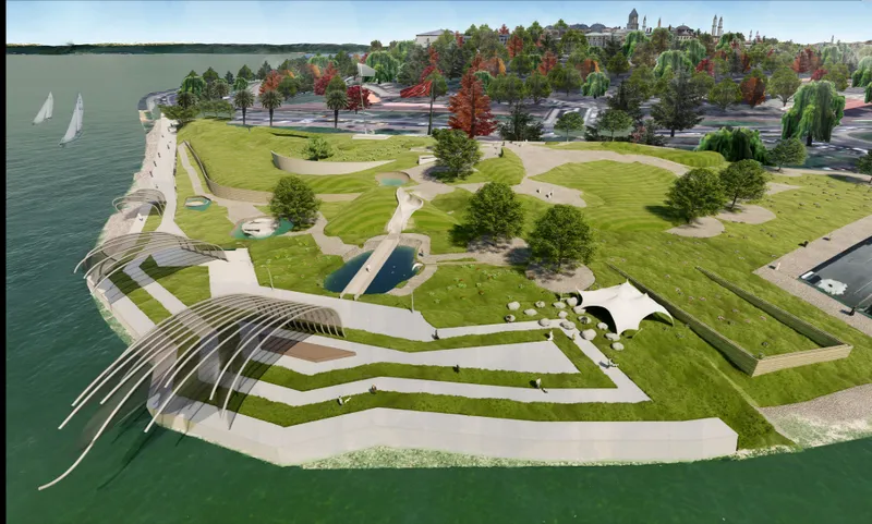 Aerial view of the ribbed canopy structure and terraced plaza extending into the waterfront park