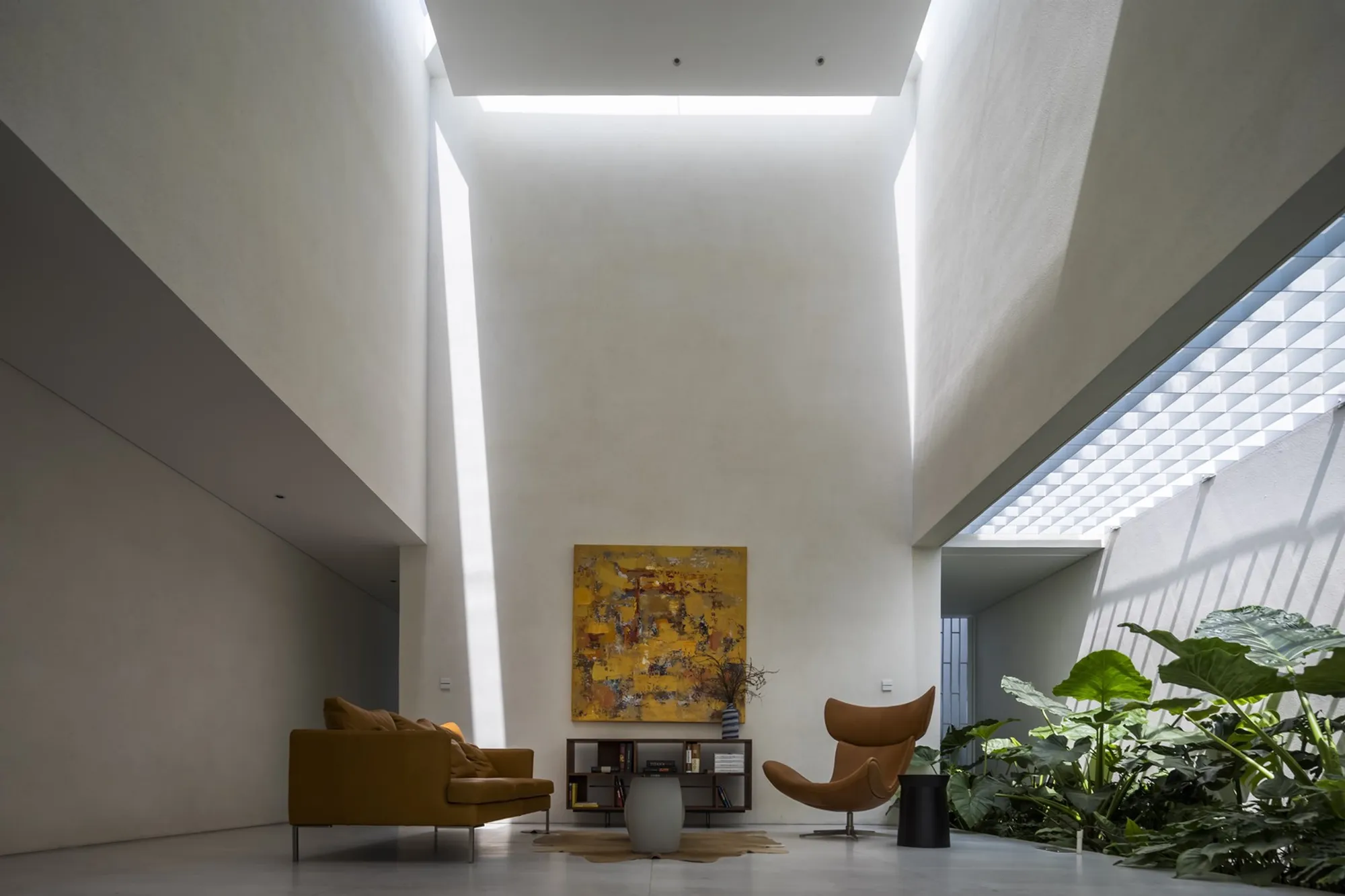 23o5Studio Carves a Cave-Inspired Concrete House Through a Narrow Plot in Củ Chi
