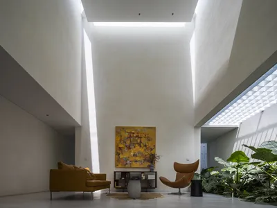 23o5Studio Carves a Cave-Inspired Concrete House Through a Narrow Plot in Củ Chi