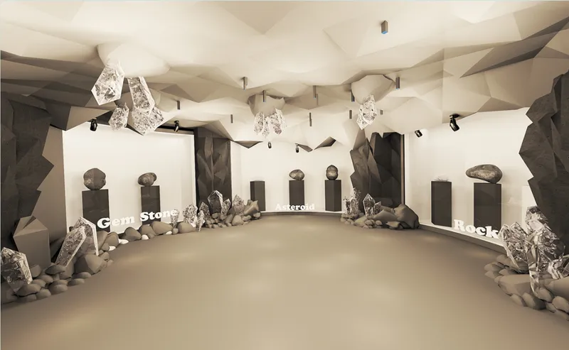 Gallery space with faceted ceiling planes, pendant lighting, and mineral specimens on pedestals along both walls