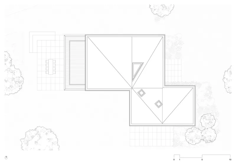 Roof plan drawing showing angular pitched roofs with skylights above two connected volumes