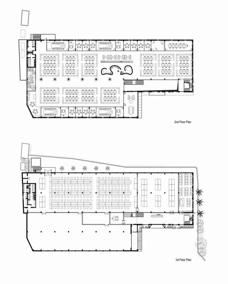 Floor plan drawings showing second level with workstations and first level with auditorium seating