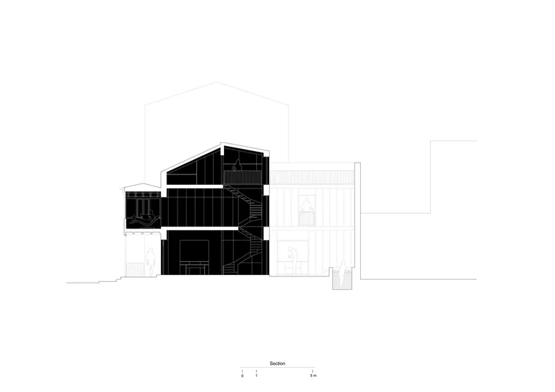 Section drawing revealing a three-story dwelling with gabled roof and exterior stairs