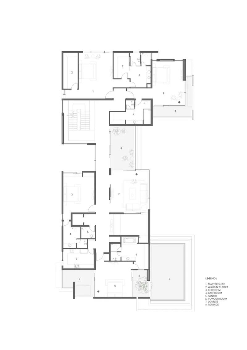 Floor plan drawing showing an L-shaped residential layout with numbered rooms and stairwell