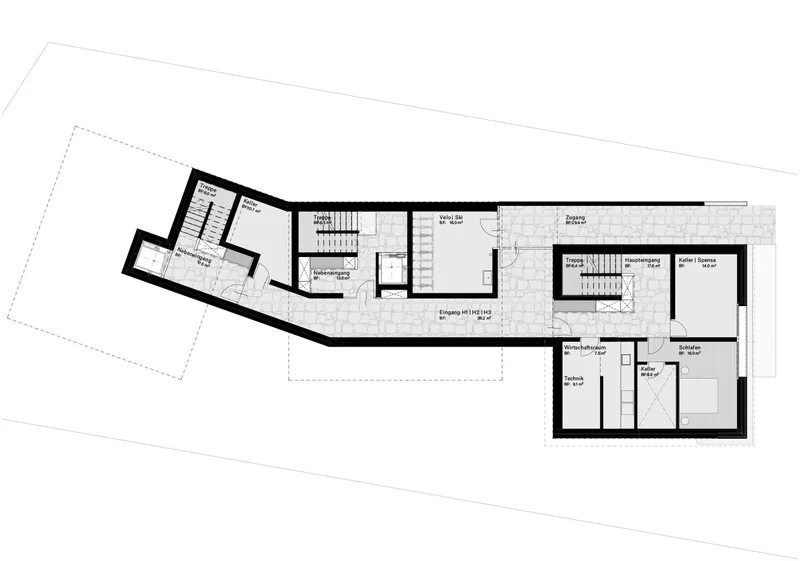 Floor plan drawing showing an elongated residential layout with central staircase and angled wing