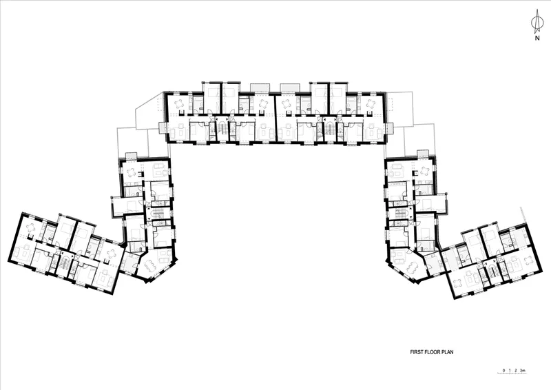 First floor plan drawing showing residential units arranged in three wings with central circulation corridor