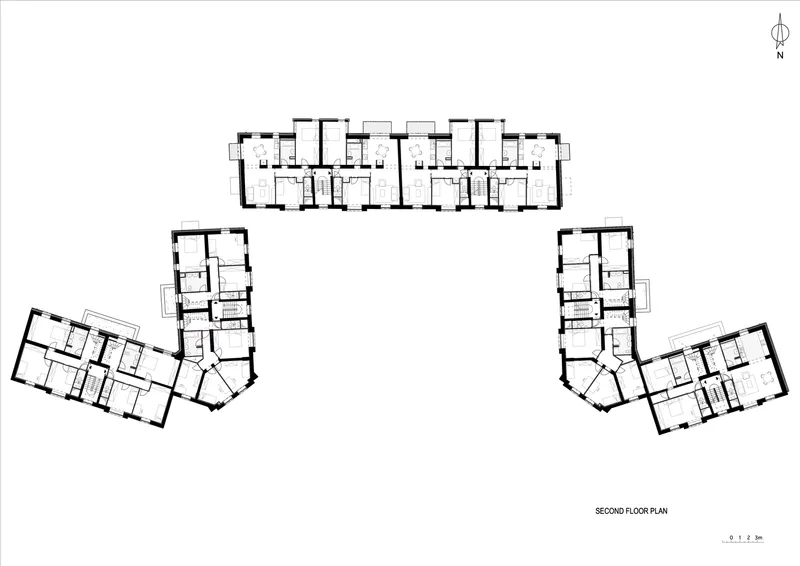 Second floor plan drawing showing repeated residential units in three wings with angled corner volumes