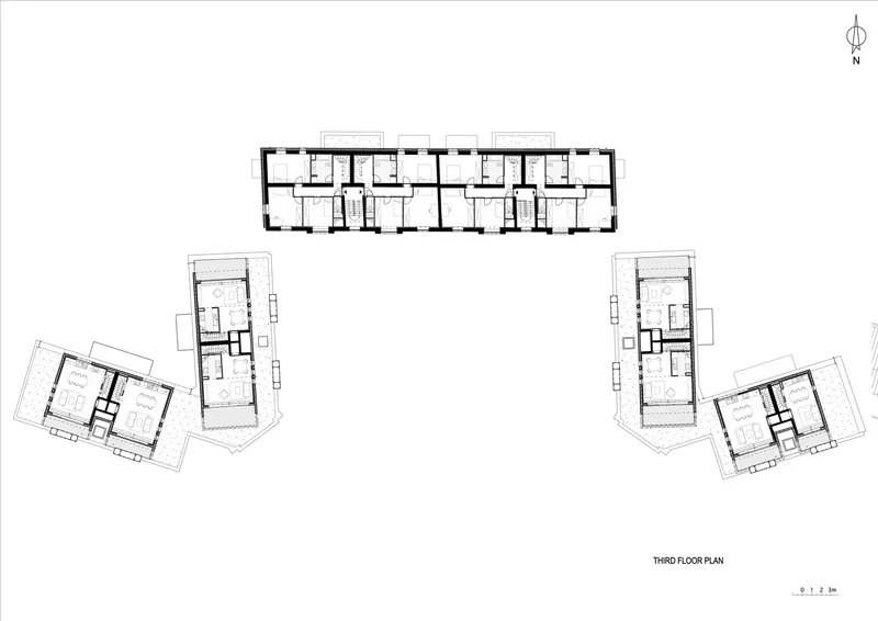 Third floor plan drawing showing a central linear bar with angled residential wings branching to either side