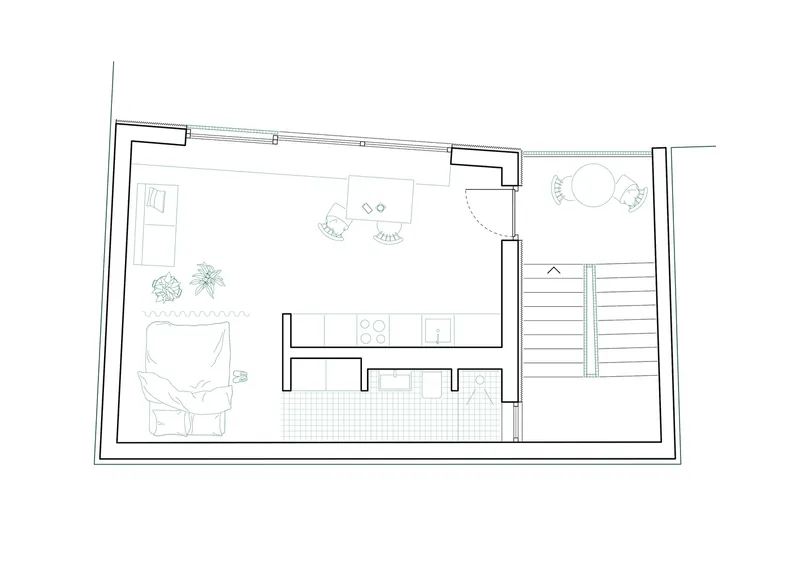 Floor plan drawing showing an open living space with kitchen, staircase, and planted terrace