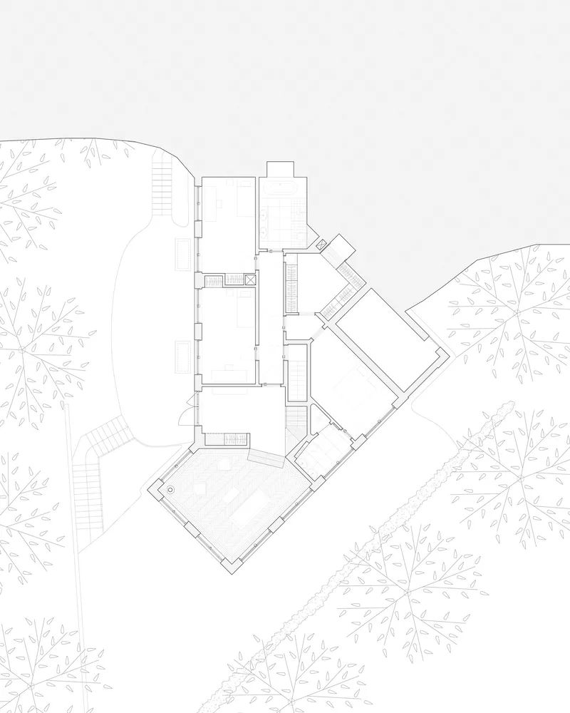 Floor plan drawing showing the multi-level arrangement of rooms with exterior staircases and landscaping