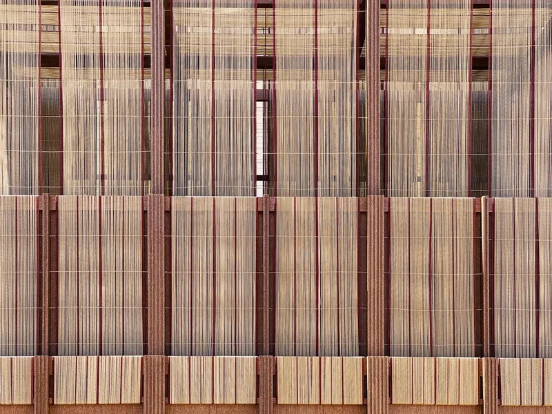 Elevation drawing showing three-level facade system with vertical and horizontal timber screen elements