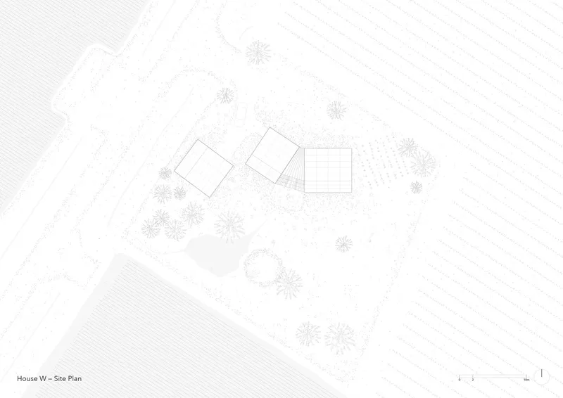 Site plan drawing showing three rectangular volumes surrounded by trees and pathways
