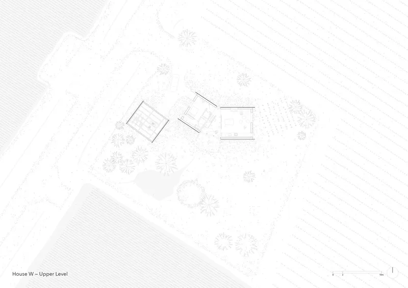 Upper level floor plan showing three angled volumes with interior room divisions and surrounding vegetation