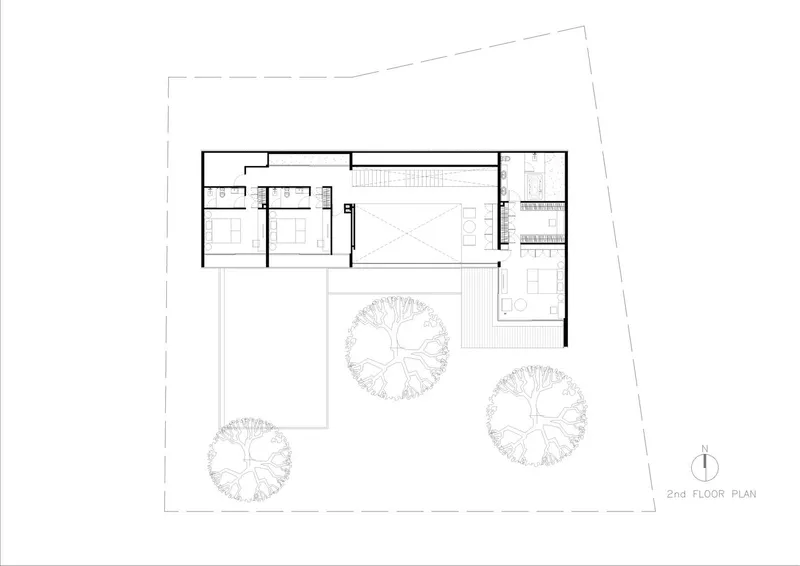 Second floor plan drawing showing bedroom wing cantilevered over pool courtyard with tree canopies below