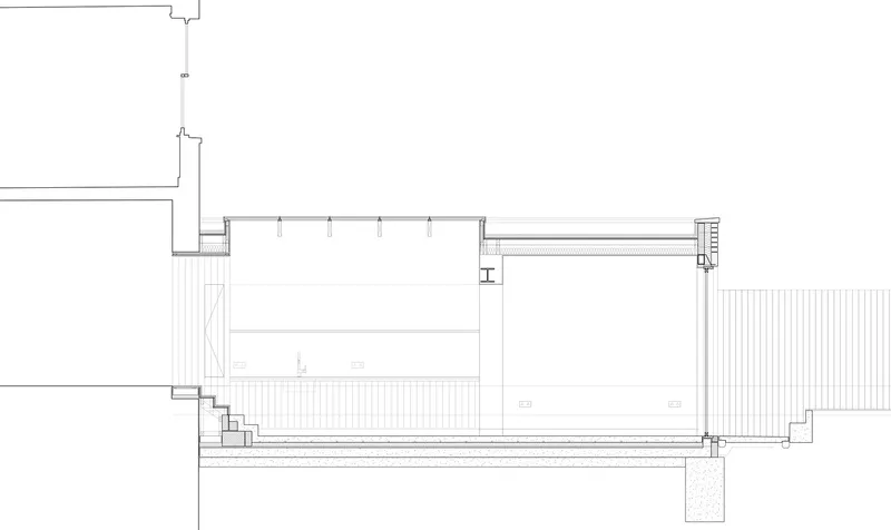 Section drawing showing rear terrace steps leading to internal space with vertical cladding at boundaries
