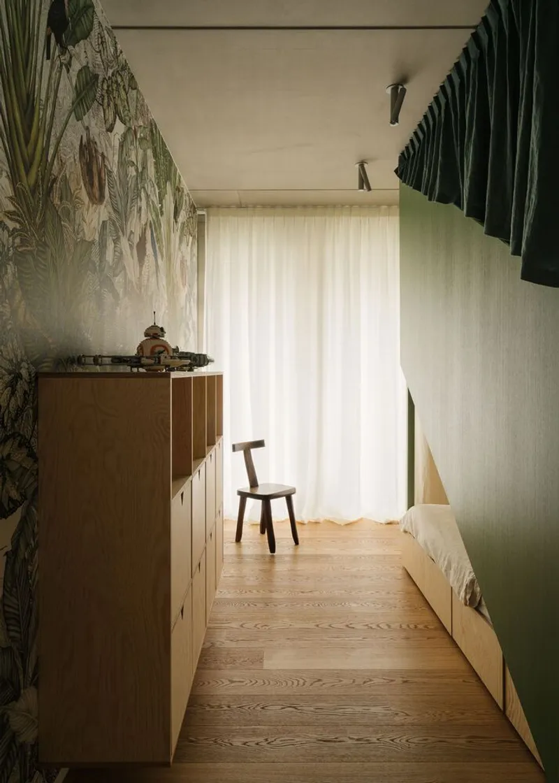 Hallway with tropical mural wallpaper, timber cabinetry, and pleated green fabric ceiling panels