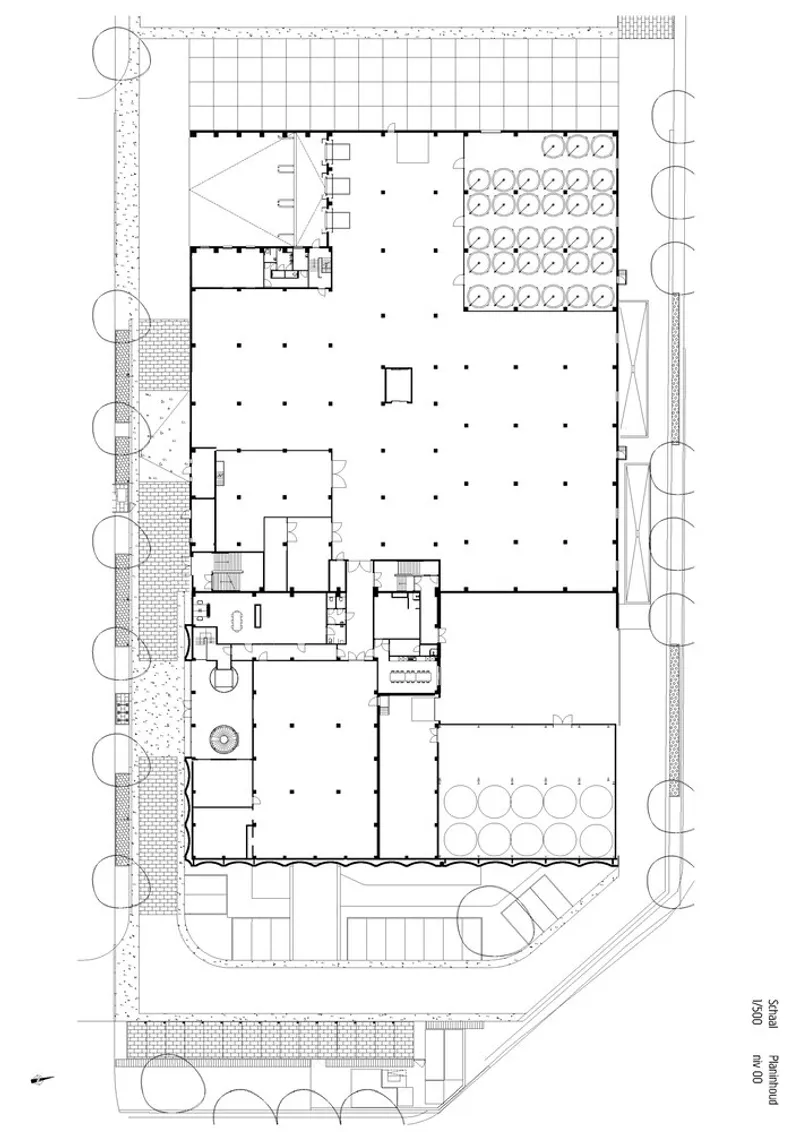 Ground floor plan drawing showing large open production spaces with circular silos and peripheral service rooms
