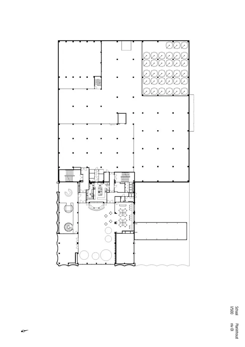 Upper floor plan drawing showing open workspaces with office areas and service cores arranged along one edge