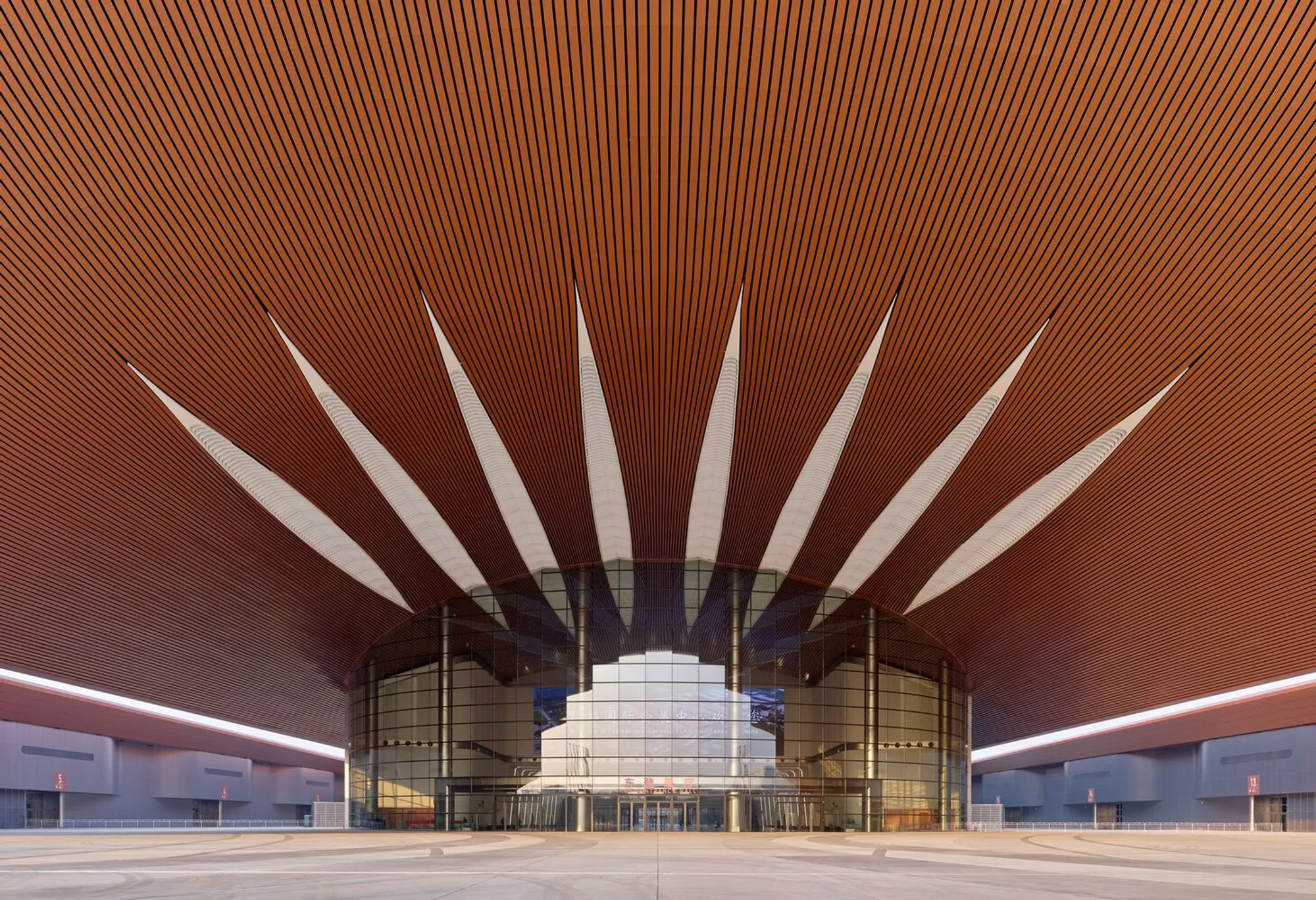 Zaha Hadid Architects Weaves 611,000 Square Meters of Copper Ribbons into Beijing's Largest Convention Center