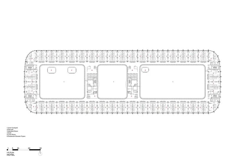 Floor plan drawing showing a hotel level with perimeter guest rooms surrounding three internal courtyards