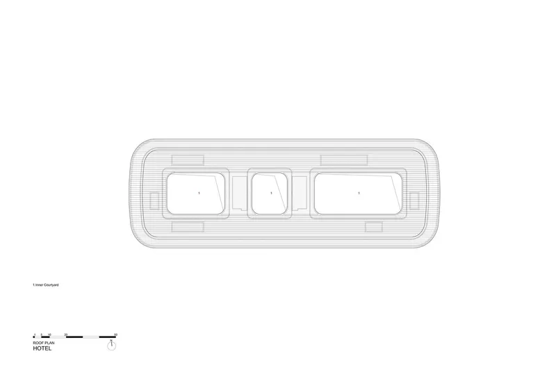 Roof plan drawing of a hotel with rounded corners and three rectangular courtyards