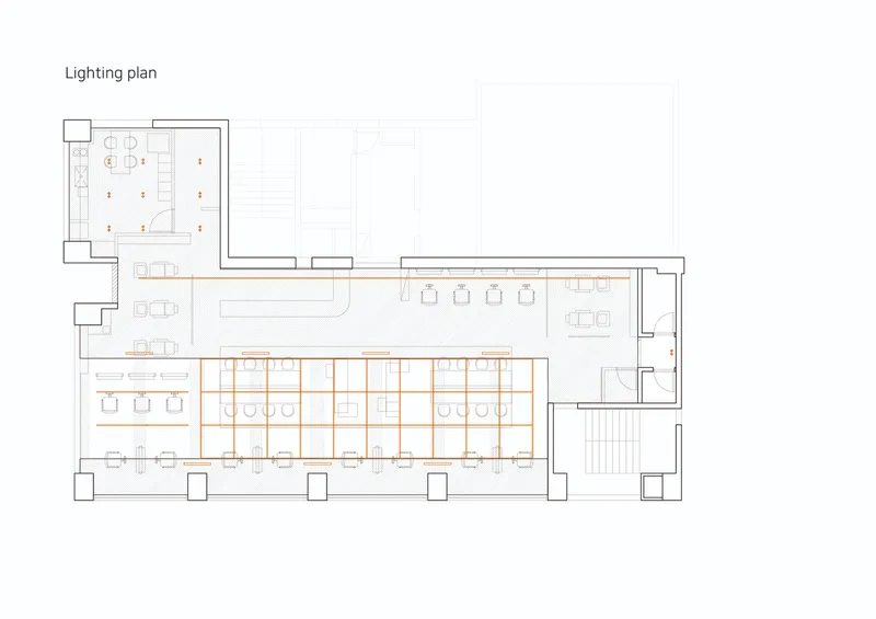 Lighting plan drawing indicating fixture locations throughout the salon with grid overlay on main cutting area
