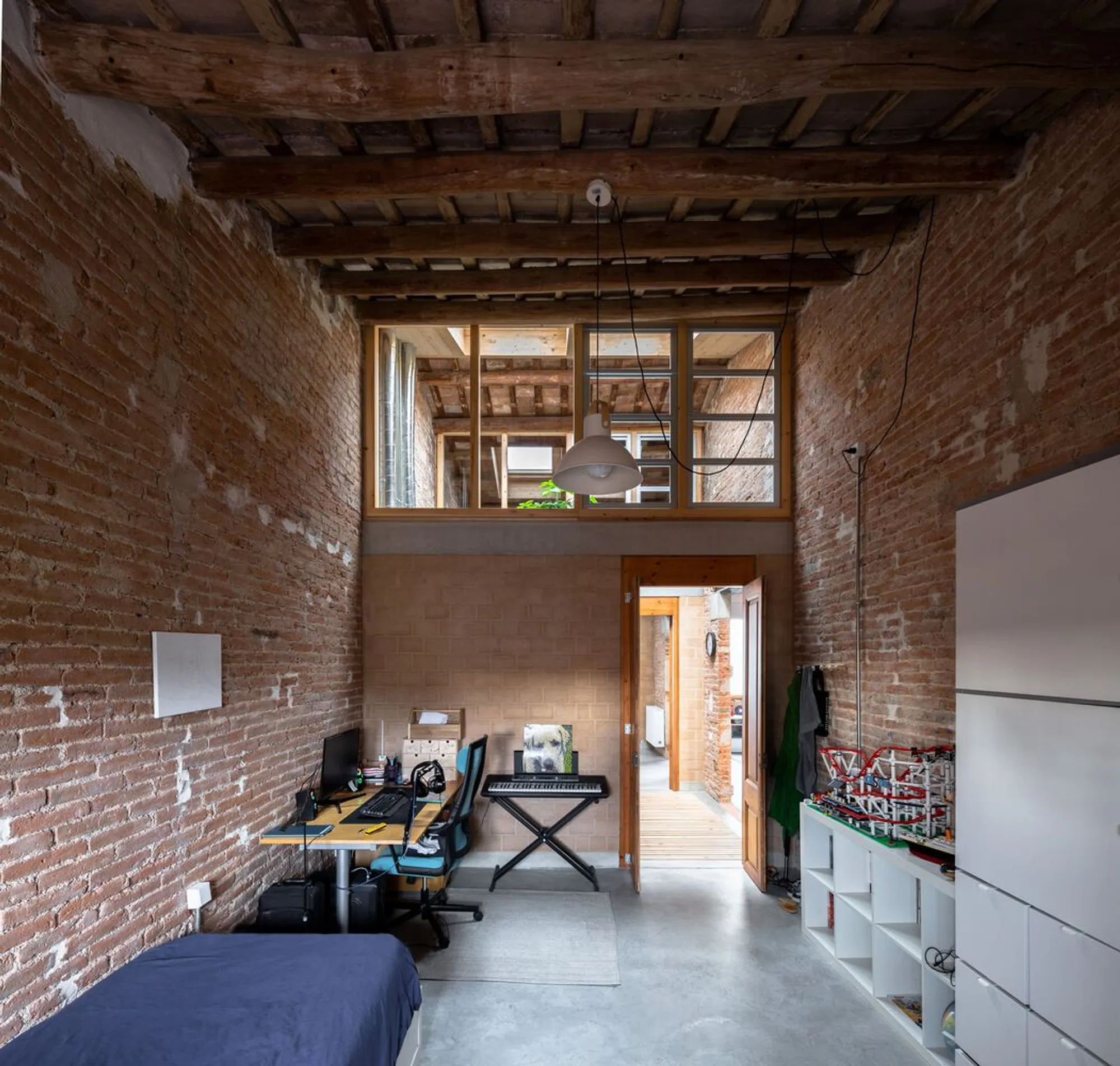Arqbag Merges Two 19th-Century Terrassa Row Houses into a Single Bioclimatic Home