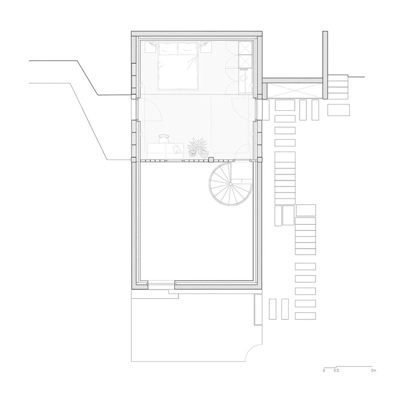 Floor plan drawing showing bedroom level with spiral stair connecting to adjacent exterior stairs