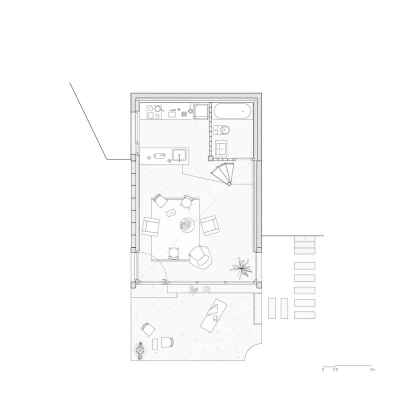 Floor plan drawing showing living area with spiral stair, kitchen, bathroom and attached terrace
