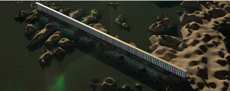 Aerial view of illuminated linear bridge crossing rocky coastal terrain at night