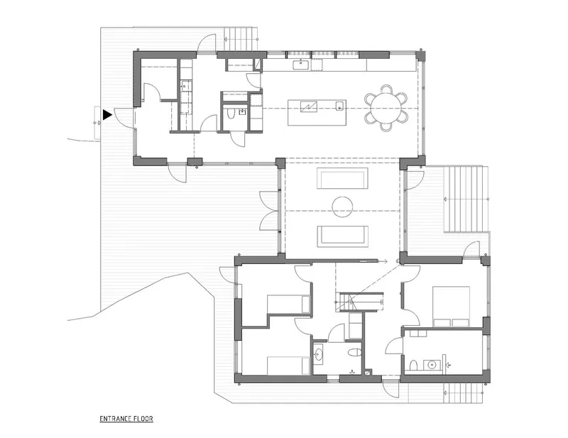 Entrance floor plan drawing showing open living and dining areas with adjacent bedrooms and bathrooms