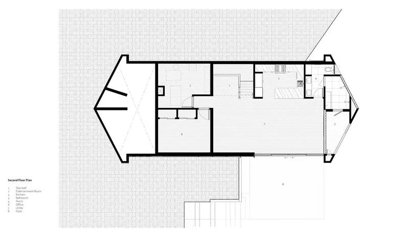Second floor plan drawing showing bedroom wing and open living spaces with two angled balconies