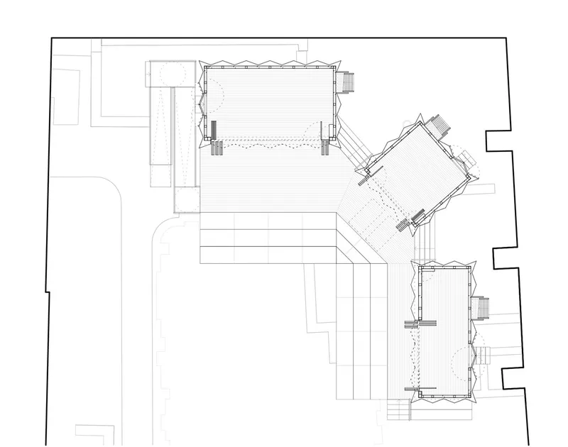 Floor plan drawing showing three rectangular volumes connected by a diagonal linking corridor
