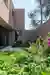 João Caetano Arquitetura Wraps a Pink House Around a Sloped Caxias Plot