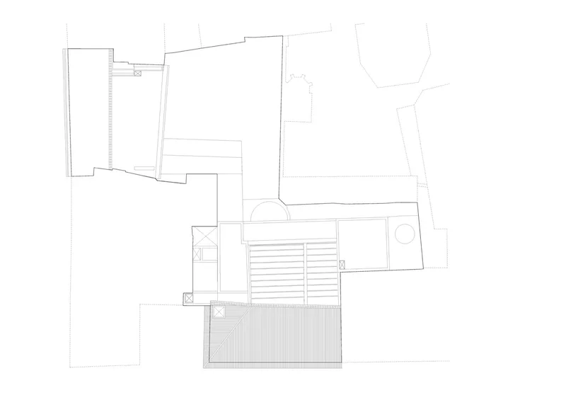 Roof plan drawing showing deck surfaces and louver system between the two building volumes