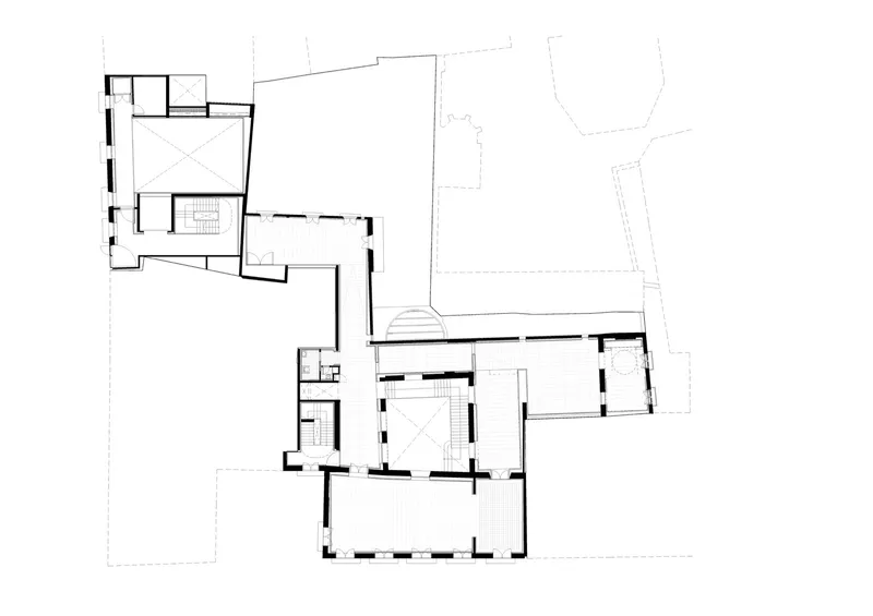 Floor plan showing two pavilions joined by a transparent connector with stairs and circulation space