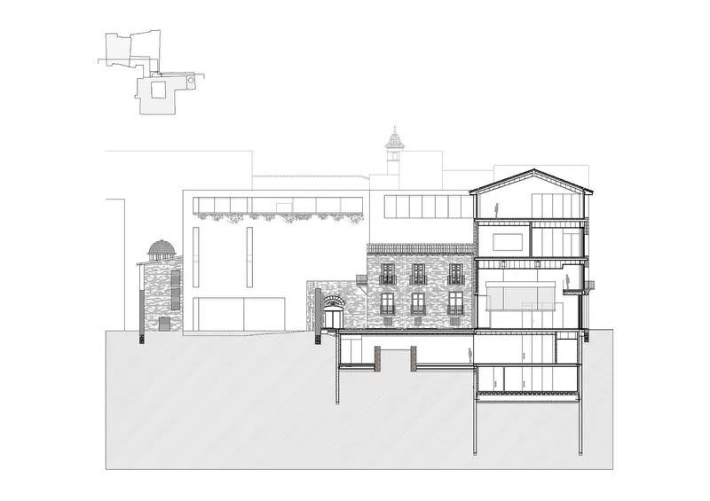 Section drawing revealing integration of historic masonry tower with timber-framed pitched roof volume