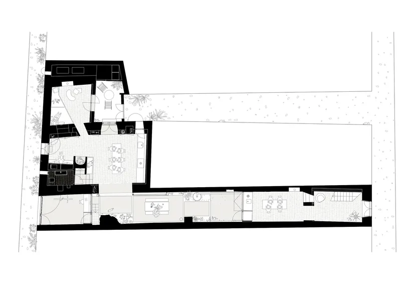 Floor plan drawing showing a multi-level residence with courtyard, planted perimeter, and terraced interior spaces