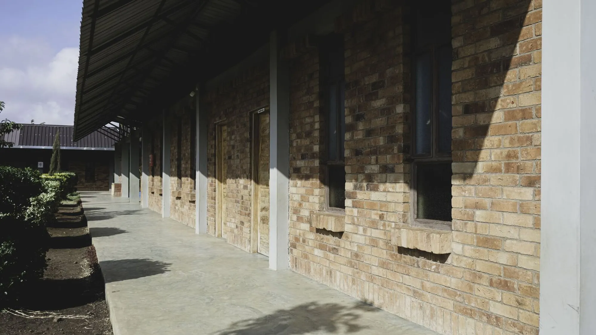 SSZA Builds a Three-Pavilion School Around a Courtyard in Arusha with Local Brick and Solar Power