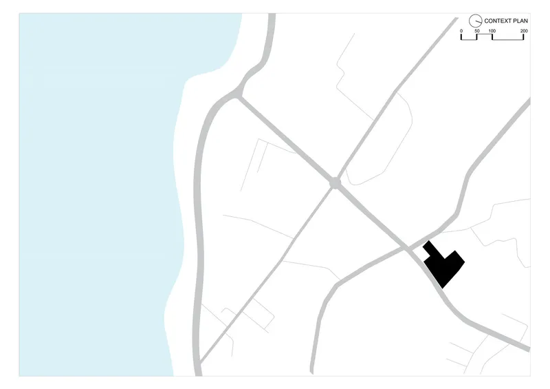 Context plan drawing showing building footprint in black against street network and waterfront