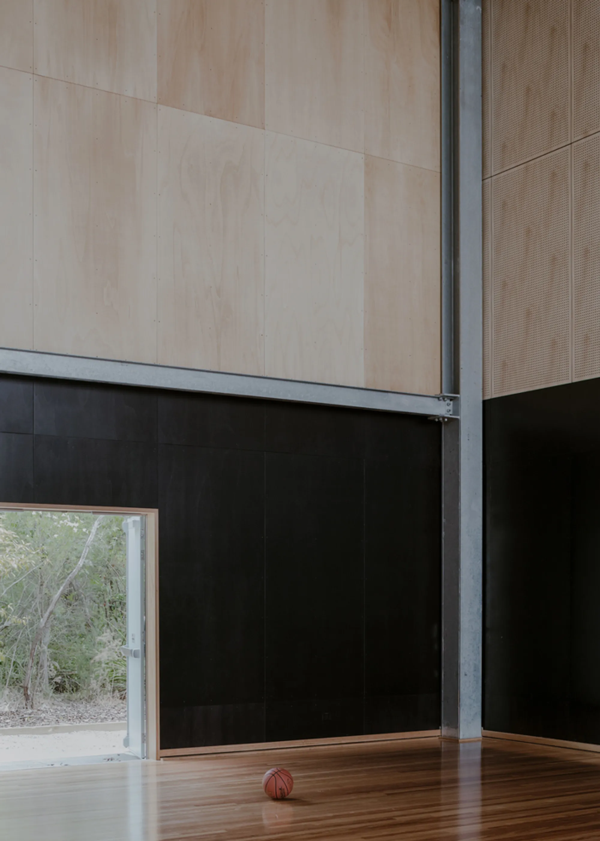 Project 12 Tucks a Glowing Gymnasium into Phillip Island Bushland at Cowes Primary School