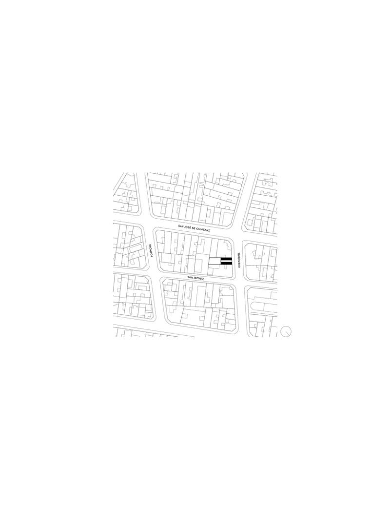 Site plan drawing showing a rectangular building footprint within a neighborhood block pattern