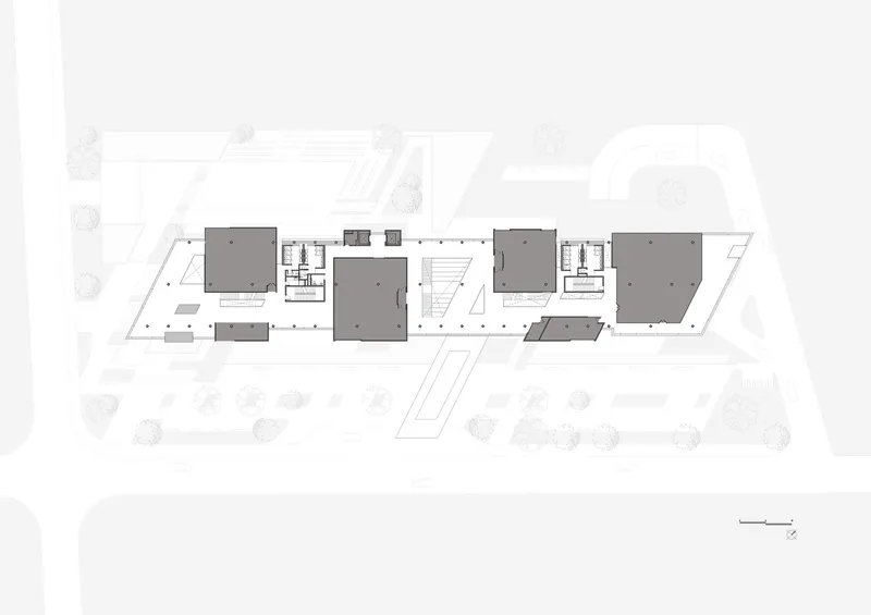 Ground floor plan drawing showing clustered building volumes with courtyards and circulation paths between them