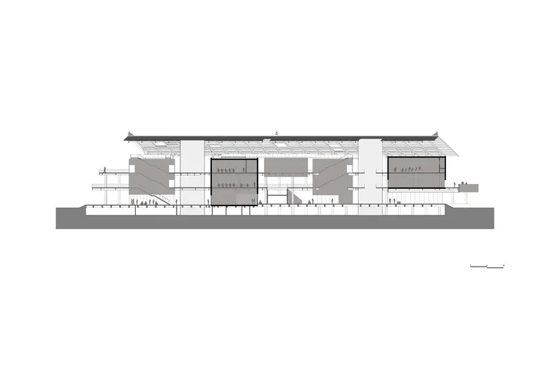 Section drawing revealing interior volumes beneath a pitched roof with clerestory openings