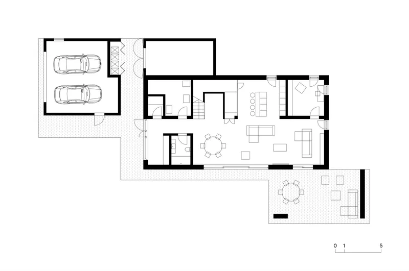 Ground floor plan drawing showing open-plan living areas, garage and extended outdoor terrace