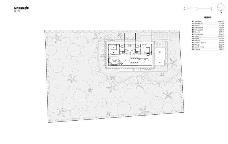 Site plan drawing showing the rectangular volume positioned within the sloped forested property