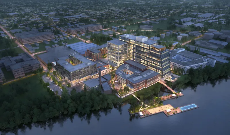 Aerial rendering of mixed-use buildings with roof terraces beside a waterfront at dusk