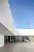 NØ ARQ Wraps a Concrete Courtyard House Around an Irregular Corner Plot in Trofa, Portugal