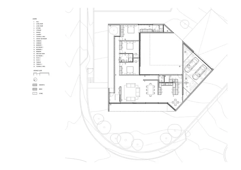Ground floor plan drawing showing an L-shaped residence with a central courtyard and surrounding landscape