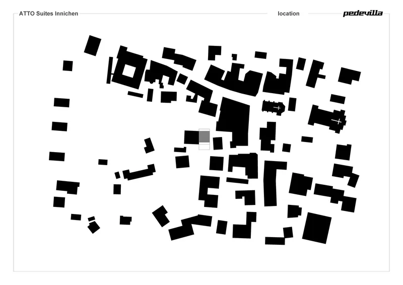 Site plan drawing showing building footprints dispersed across an existing village fabric
